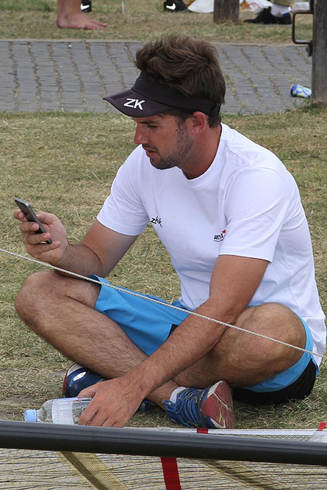 Seve Jarvin checks the weather on his phone-1 - Day 4 - 3 Buoys Challenge - Sydney Harbour November 3, 2012 © Frank Quealey /Australian 18 Footers League http://www.18footers.com.au